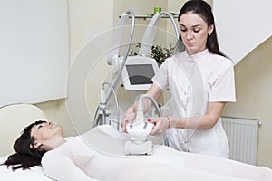 The procedure of lipomassage in a beauty salon