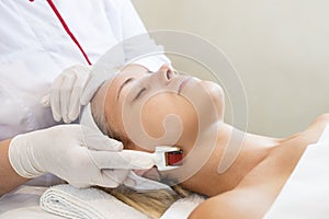 Procedure of medical micro needle therapy with a modern medical instrument derma roller