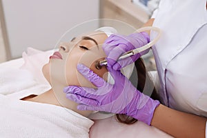 Procedure of Microdermabrasion. photo