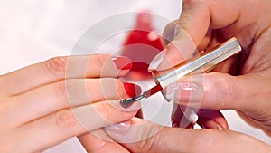 The procedure of painting nails in the spa salon.Manicure procedure in the beauty salon.Spa manicure procedure