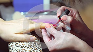 The procedure of painting nails in the spa salon.Manicure procedure in the beauty salon.Spa manicure procedure.Paint