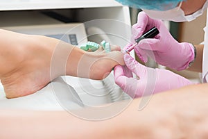 Procedure of pedicure in beauty salon