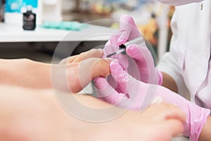 Procedure of pedicure in beauty salon