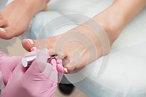 Procedure of pedicure in beauty salon