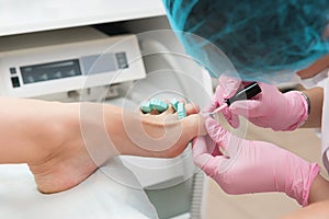 Procedure of pedicure in beauty salon