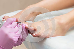 Procedure of pedicure in beauty salon