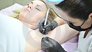 Procedure removal of hair permanently in woman's armpits using electro epilation