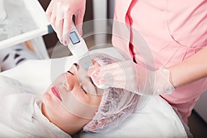 Procedure of ultrasound face cleaning.