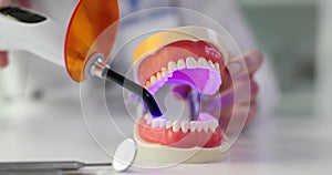 Procedure for whitening and treating dental caries using ultraviolet light