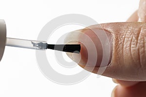 Proces nail polish isolated on white background. Colorless nail polish.Hand and nail polish photo
