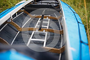 The process of assembling and repairing kayaks: metal skeleton, PVC skin, wooden and aluminum frames.