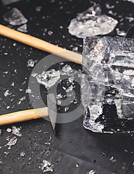 Process of breaking the ice with hammer and ice pick, group of people smashing shattered ice cube, team work success concept,