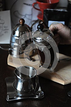 The process of brewing coffee. Barista pours coffee from the french press. Close-up