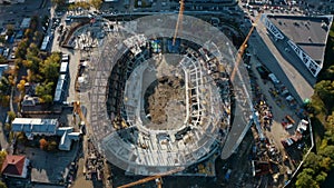 Process of building a stadium, aerial top view. Stock footage. Construction site, creation of metal structures during