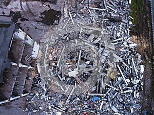 A process of buliding demolition, demolished house, shot from air with drone