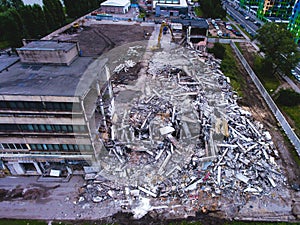 A process of buliding demolition, demolished house, shot from air with drone