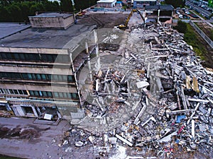 A process of buliding demolition, demolished house, shot from air with drone