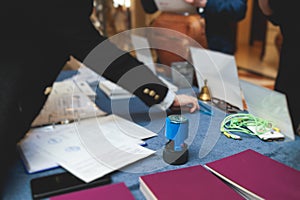 Process of checking in on a conference congress forum event, registration desk table, visitors and attendees receiving a name