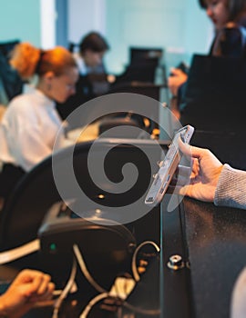 Process of checking in on a conference congress forum event, registration desk table, visitors and attendees receiving a name