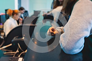 Process of checking in on a conference congress forum event, registration desk table, visitors and attendees receiving a name