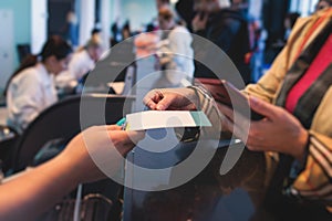 Process of checking in on a conference congress forum event, registration desk table, visitors and attendees receiving a name