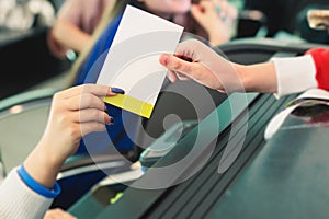 Process of checking in on a conference congress forum event, registration desk table, visitors and attendees receiving a name