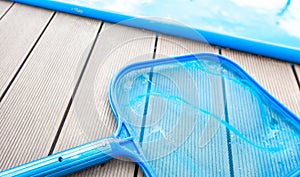 Process of cleaning swimming pool by a hand net during summer time season