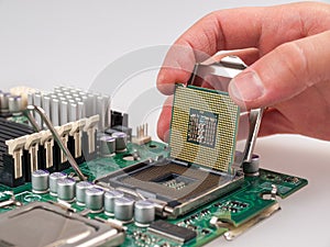 The process of connecting the CPU to the processor socket on a modern computer motherboard, replacing the silicon data processing