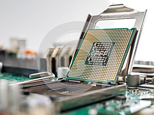 The process of connecting the CPU to the processor socket on a modern computer motherboard, replacing the silicon data processing