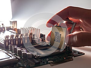 The process of connecting the CPU to the processor socket on a modern computer motherboard, replacing the silicon data processing