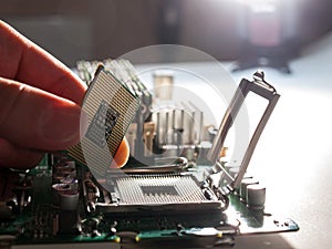 The process of connecting the CPU to the processor socket on a modern computer motherboard, replacing the silicon data processing