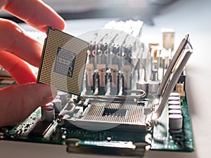 The process of connecting the CPU to the processor socket on a modern computer motherboard, replacing the silicon data processing