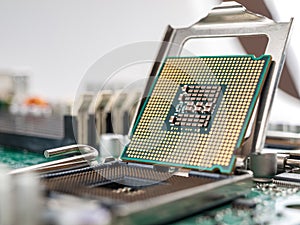 The process of connecting the CPU to the processor socket on a modern computer motherboard, replacing the silicon data processing
