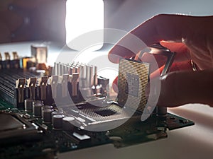 The process of connecting the CPU to the processor socket on a modern computer motherboard, replacing the silicon data processing