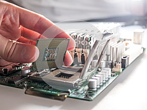The process of connecting the CPU to the processor socket on a modern computer motherboard, replacing the silicon data processing