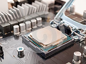 The process of connecting the CPU to the processor socket on a modern computer motherboard, replacing the silicon data processing