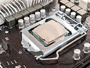 The process of connecting the CPU to the processor socket on a modern computer motherboard, replacing the silicon data processing