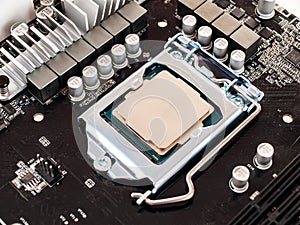 The process of connecting the CPU to the processor socket on a modern computer motherboard, replacing the silicon data processing