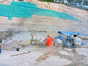 Process of constructing barriers to prevent landslides which often occur in the area.