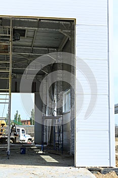 The process of construction and launch of a large logistics center, its internal filling and finishing