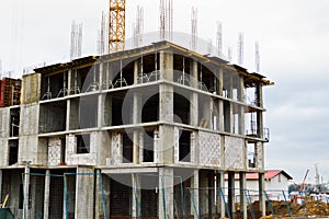 The process of construction and repair of a new modern cement concrete stone pannel monolithic frame-block building of a house
