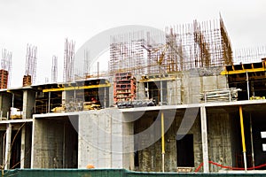 The process of construction and repair of a new modern cement concrete stone pannel monolithic frame-block building of a house