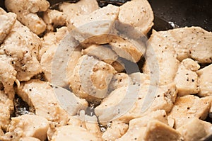 The process of cooking chicken breast diet for an athlete in a frying pan in sunflower oil. Meat for muscle recovery after