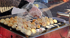 Process of cooking takoyaki on street
