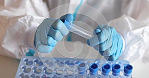 Process of coronavirus PCR antigen testing examination by nurse medic in laboratory lab, COVID-19 swab collection kit, test tube