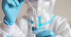 Process of coronavirus PCR antigen testing examination by nurse medic in laboratory lab, COVID-19 swab collection kit, test tube