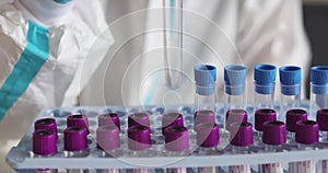 Process of coronavirus PCR antigen testing examination by nurse medic in laboratory lab, COVID-19 swab collection kit, test tube