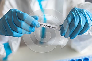 Process of coronavirus PCR antigen testing examination by nurse medic in laboratory lab, COVID-19 swab collection kit, test tube