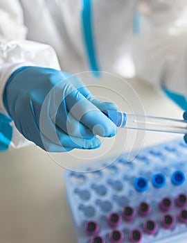 Process of coronavirus PCR antigen testing examination by nurse medic in laboratory lab, COVID-19 swab collection kit, test tube