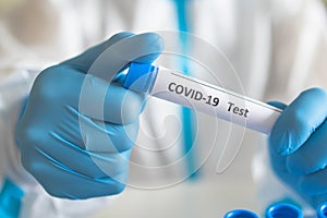 Process of coronavirus PCR antigen testing examination by nurse medic in laboratory lab, COVID-19 swab collection kit, test tube